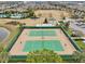 Two tennis courts with players, surrounded by landscaping at 8714 Sonoma Coast Dr, Winter Garden, FL 34787