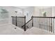 Upstairs hallway with iron railing and carpet flooring at 8714 Sonoma Coast Dr, Winter Garden, FL 34787