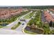 Gated community entrance with landscaping and a guardhouse at 8956 California Palm Rd, Kissimmee, FL 34747
