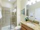 Bathroom with shower and granite vanity at 8956 California Palm Rd, Kissimmee, FL 34747