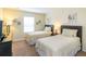Bedroom with two twin beds and dresser at 8956 California Palm Rd, Kissimmee, FL 34747