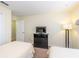 Bedroom with two twin beds and dresser at 8956 California Palm Rd, Kissimmee, FL 34747
