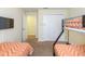 Bedroom with bunk beds and TV at 8956 California Palm Rd, Kissimmee, FL 34747