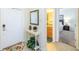 Bright entryway with mirror, console table, and view of bedroom at 8956 California Palm Rd, Kissimmee, FL 34747