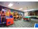 Community game room with arcade games and billiards at 8956 California Palm Rd, Kissimmee, FL 34747