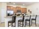 Kitchen with granite countertops, stainless steel appliances, and light wood cabinets at 8956 California Palm Rd, Kissimmee, FL 34747