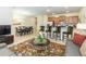 Open concept kitchen with island, stainless steel appliances, and dining area at 8956 California Palm Rd, Kissimmee, FL 34747