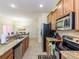 Kitchen with stainless steel appliances and granite countertops at 8956 California Palm Rd, Kissimmee, FL 34747
