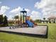 playground with slides and climbing structures at 8956 California Palm Rd, Kissimmee, FL 34747