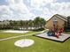 Community playground with play structures near a volleyball court at 8956 California Palm Rd, Kissimmee, FL 34747