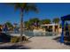 Community pool with a rock grotto and water features at 8956 California Palm Rd, Kissimmee, FL 34747