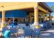 Community pool area features a shaded bar and plenty of seating at 8956 California Palm Rd, Kissimmee, FL 34747