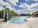Large community pool with water features and a ' play area at 8956 California Palm Rd, Kissimmee, FL 34747