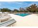 Inviting community pool with lounge chairs and a nearby playground at 9549 Southern Garden Cir, Altamonte Springs, FL 32714