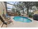 Inviting screened pool area with lounge chairs at 9549 Southern Garden Cir, Altamonte Springs, FL 32714