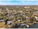 Aerial view of waterfront home community with lush trees and lake access at 1115 Lake Nettie Dr Dr, Eustis, FL 32726