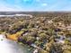 Aerial showcasing waterfront homes, lush landscape, and a private dock at 1115 Lake Nettie Dr Dr, Eustis, FL 32726