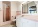 Vintage bathroom featuring pink tiling and a classic vanity at 1115 Lake Nettie Dr Dr, Eustis, FL 32726