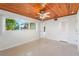 Bedroom with wood ceiling and tile floors at 1115 Lake Nettie Dr Dr, Eustis, FL 32726