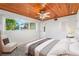 Bedroom featuring light colors and a large window that allows plenty of natural light at 1115 Lake Nettie Dr Dr, Eustis, FL 32726