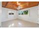 Bedroom with wood ceiling, tile floors and water views at 1115 Lake Nettie Dr Dr, Eustis, FL 32726
