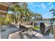 Deck overlooking lake with seating and grill at 1115 Lake Nettie Dr Dr, Eustis, FL 32726