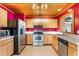 Cozy kitchen equipped with stainless steel appliances and bright cabinets at 1115 Lake Nettie Dr Dr, Eustis, FL 32726