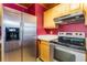 Stainless steel appliances and wood cabinets in this kitchen at 1115 Lake Nettie Dr Dr, Eustis, FL 32726