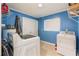 Laundry room with washer, dryer and storage at 1115 Lake Nettie Dr Dr, Eustis, FL 32726