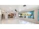 Living room with lake view and kitchen access at 1115 Lake Nettie Dr Dr, Eustis, FL 32726