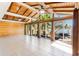 Bright open-concept living room with wood ceiling and lake views at 1115 Lake Nettie Dr Dr, Eustis, FL 32726