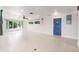 Spacious living room with hardwood floors and blue door at 1115 Lake Nettie Dr Dr, Eustis, FL 32726