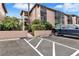Exterior view of condo building with parking and landscaping at 122 Water Front Way # 370, Altamonte Springs, FL 32701