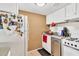 Galley-style kitchen with white cabinets and granite countertops at 122 Water Front Way # 370, Altamonte Springs, FL 32701