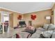 Living room features gray couch, TV, and decorative rug at 122 Water Front Way # 370, Altamonte Springs, FL 32701