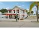 White building with red awnings and outdoor seating at 12795 Trovita Dr, Grand Island, FL 32735