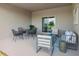 Relaxing covered patio with seating area and outdoor furniture at 12898 Trovita Dr, Grand Island, FL 32735