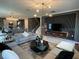Open concept living room with sectional sofa and large windows at 1445 Olympic Club Blvd, Champions Gate, FL 33896