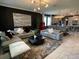 Modern living room with gray sectional sofa and geometric coffee table at 1445 Olympic Club Blvd, Champions Gate, FL 33896