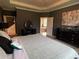 Luxurious main bedroom suite with ensuite bathroom access at 1445 Olympic Club Blvd, Champions Gate, FL 33896