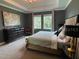 Spacious main bedroom with large bed and plenty of closet space at 1445 Olympic Club Blvd, Champions Gate, FL 33896