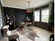 Bright home office with desk, two chairs, and stylish decor at 1445 Olympic Club Blvd, Champions Gate, FL 33896