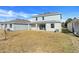 View of home's rear and expansive grassy backyard at 1582 Outback W Rd, St Cloud, FL 34771