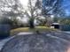 Large backyard with mature trees and shed at 1606 Lime St, Kissimmee, FL 34746