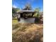 Outdoor bar in backyard with corrugated metal top at 1606 Lime St, Kissimmee, FL 34746