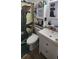 Bathroom featuring a toilet, sink and storage cabinet at 1606 Lime St, Kissimmee, FL 34746