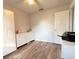 Well-lit bedroom with wood-look floors, perfect for creating a relaxing retreat at 1606 Lime St, Kissimmee, FL 34746