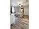 Cozy bedroom features wood-look floors and a comfortable bed at 1606 Lime St, Kissimmee, FL 34746