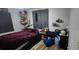 Bedroom featuring a double bed, a window, and a bedside table at 1606 Lime St, Kissimmee, FL 34746