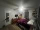 Spacious bedroom with a queen-size bed and dresser at 1606 Lime St, Kissimmee, FL 34746
